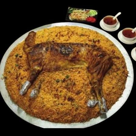 WHOLE GRILLED GOAT WITH RICE